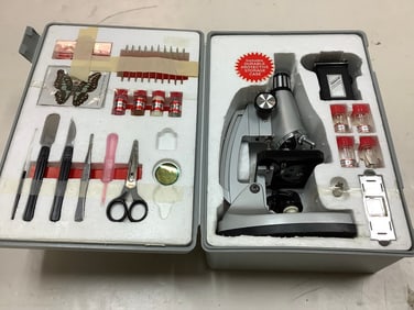 Tasco microscope set in storage case