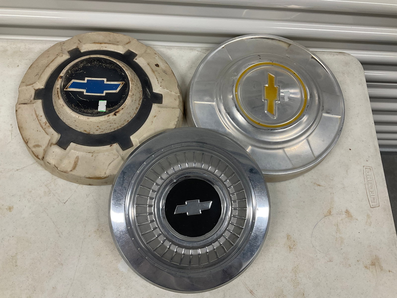 lot of three vintage hub caps (1 of 1)