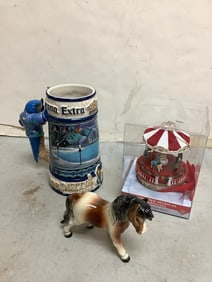 Mr. Christmas animated musical carousel, Corona beer mug(7in.tall), and Goebel ceramic statue