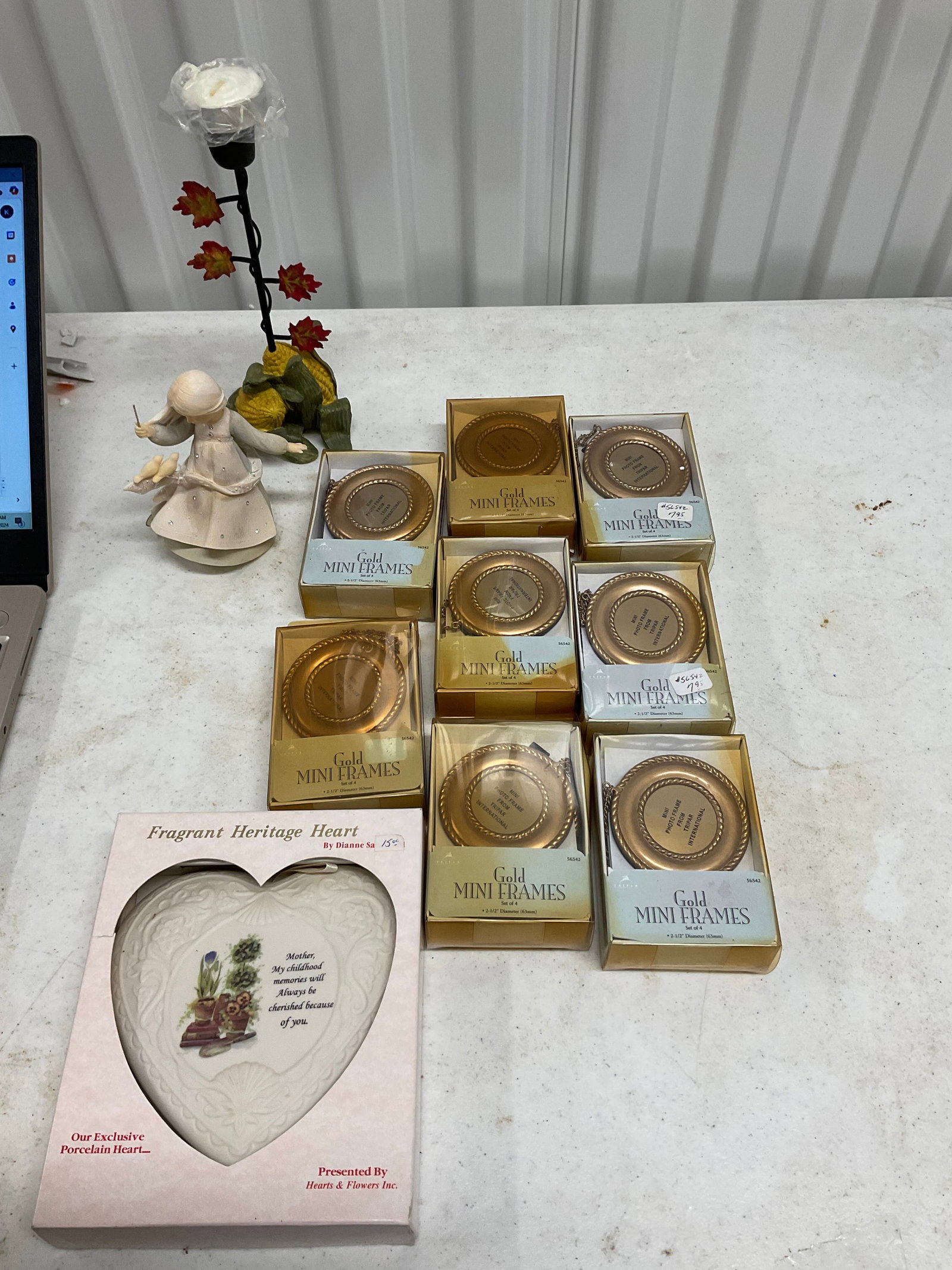 lot of mini gold frames, cast iron candel holder,heritage heart and mpre (1 of 1)