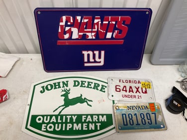 Lot of metal signs and motorcycle license plates