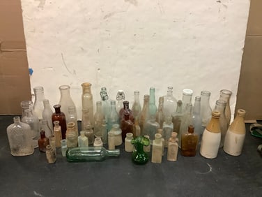 Vintage glass bottles(dairy, pharmaceutical, and more-tallest 10.25in.)