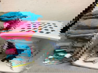 Laundry basket with wheels(19in.tall, missing handle) and various washcloths/towels