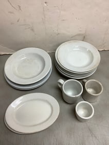 Various ironstone plates and various mugs(4.5in.tallest)