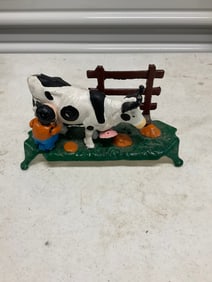 vintage cast iron kicking milking bank