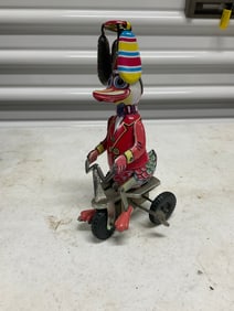 vintage tin duck on bike wind up toy