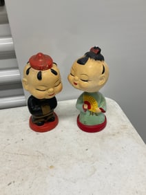 set of two oriental men and women bobble heads
