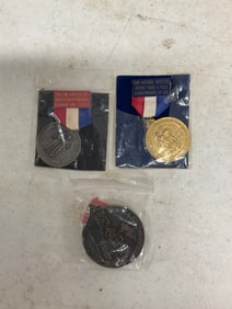 lot of three track and field and other medals