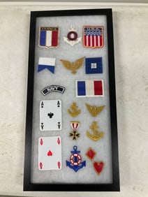 lot of military and other patches in shadow box 21 x 10