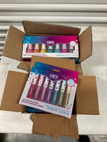 case full of 7 day glitter lip glosses and nail polish