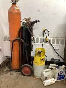 Oxy aceteleyne torch setup, oil, and freon tanks
