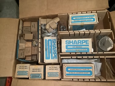 Box of new paint sprayer rebuild kits