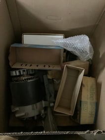 Box full of new rebuild electric motor parts