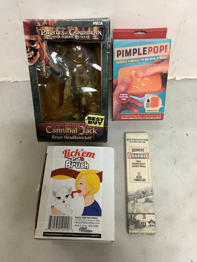 Pirates of the Carribean cannibal Jack resin headknocker, Pimple Pop toy, Derwent graphuc graphite: Pirates of the Carribean cannibal Jack resin headknocker, Pimple Pop toy, Derwent graphuc graphite pencils, and Lick'em cat brush
