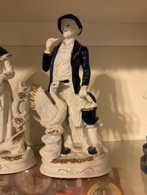 vintage blue and white porelceian figurine man with hat and bird 13" tall
