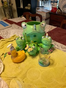 lot of bathroom items, trash can, soap despensor, tooth brushhlder and more