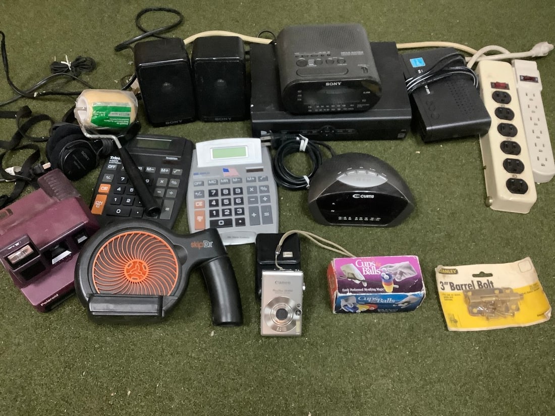 Canon camera, desk top calculators, Polaroid camera, power strips, Sony alarm clock radio, and more (1 of 1)