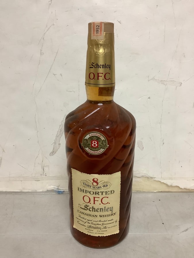1952 Imported O.F.C. by Schenley canadian whisky 86.8 proof 40oz.(sealed with certificate of age): Any contents in bottle is Free; You are bidding on the bottle & unbroken tax stamp