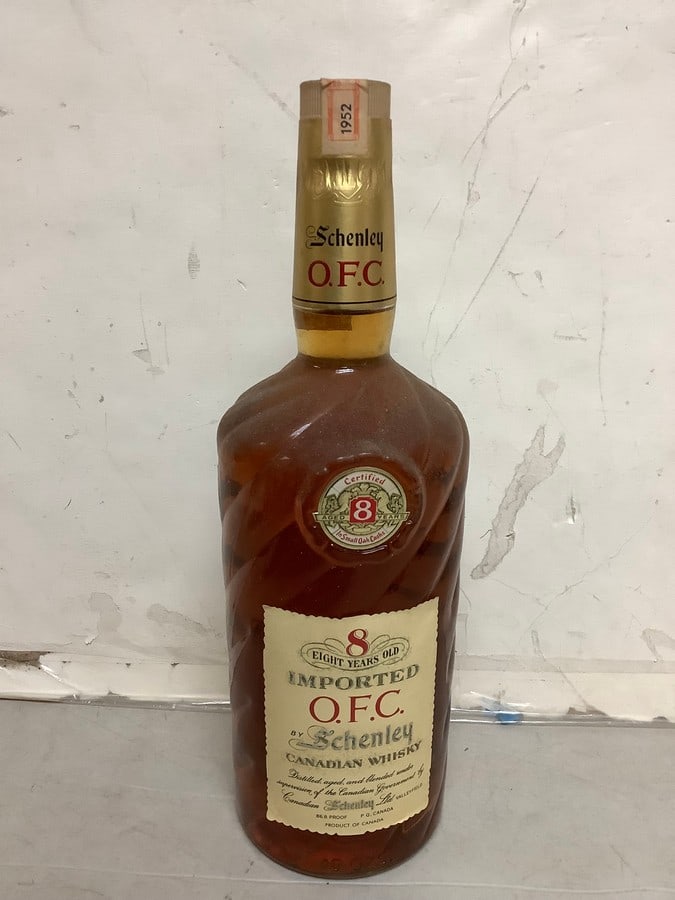 1952 Imported O.F.C. by Schenley canadian whisky 86.8 proof 40oz.(sealed with certificate of age): Any contents in bottle is Free; You are bidding on the bottle & unbroken tax stamp