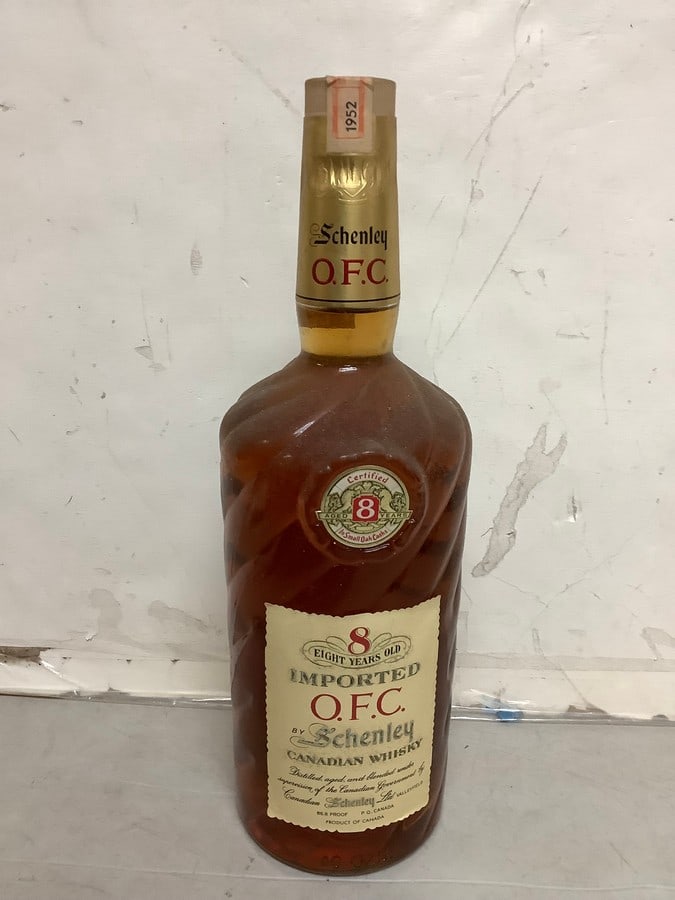 1952 Imported O.F.C. by Schenley canadian whisky 86.8 proof 40oz.(sealed with certificate of age): Any contents in bottle is Free; You are bidding on the bottle & unbroken tax stamp