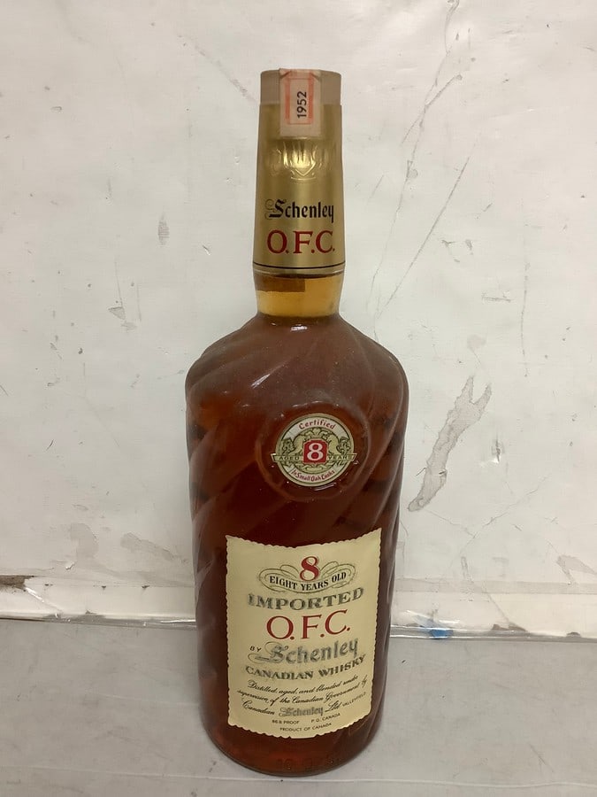 1952 Imported O.F.C. by Schenley canadian whisky 86.8 proof 40oz.(sealed with certificate of age): Any contents in bottle is Free; You are bidding on the bottle & unbroken tax stamp