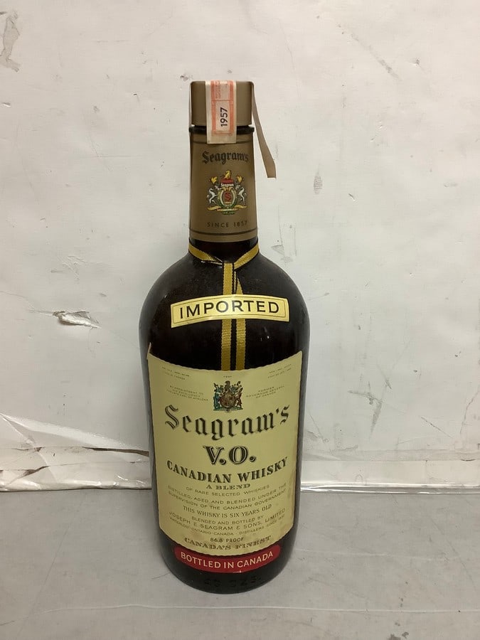 1957 Imported Seagram's V.O. canadian whisky 86.8 proof 40ozs.(sealed): Any contents in bottle is Free; You are bidding on the bottle & unbroken tax stamp