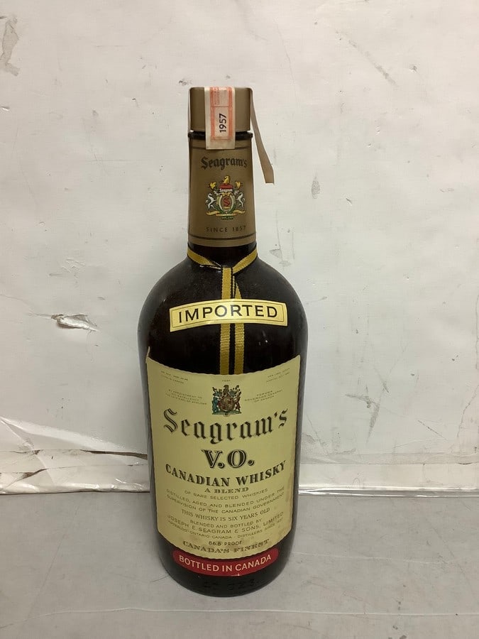 1957 Imported Seagram's V.O. canadian whisky 86.8 proof 40ozs.(sealed): Any contents in bottle is Free; You are bidding on the bottle & unbroken tax stamp