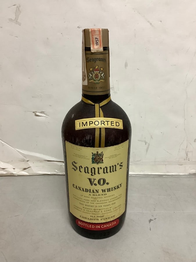 1957 Imported Seagram's V.O. canadian whisky 86.8 proof 40ozs.(sealed): Any contents in bottle is Free; You are bidding on the bottle & unbroken tax stamp