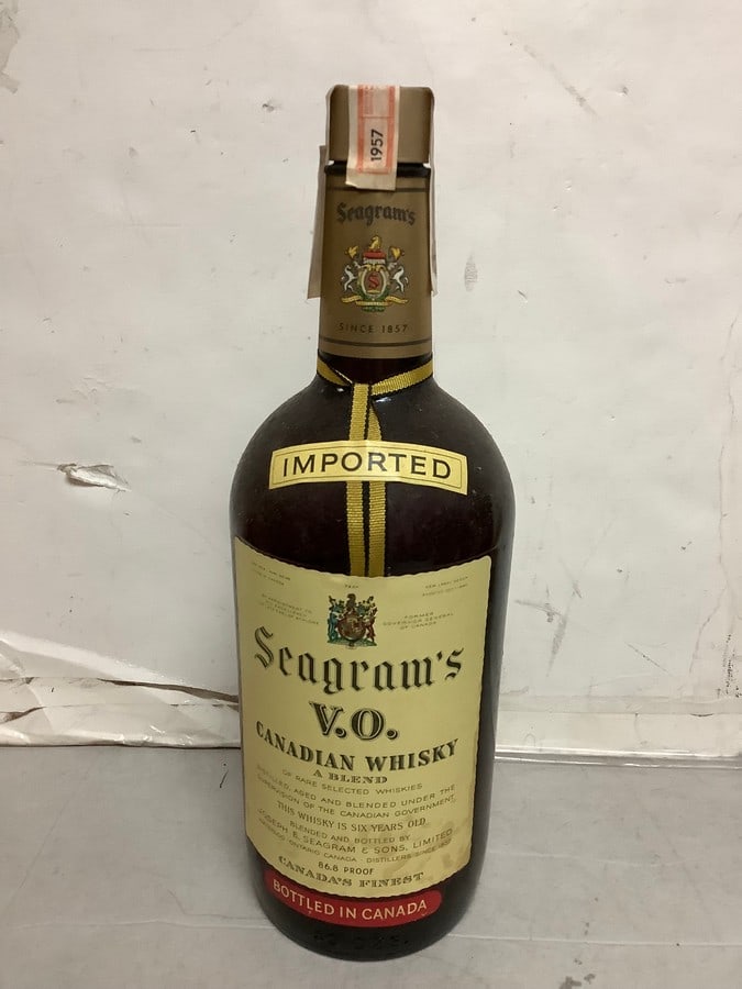 1957 Imported Seagram's V.O. canadian whisky 86.8 proof 40ozs.(sealed): Any contents in bottle is Free; You are bidding on the bottle & unbroken tax stamp