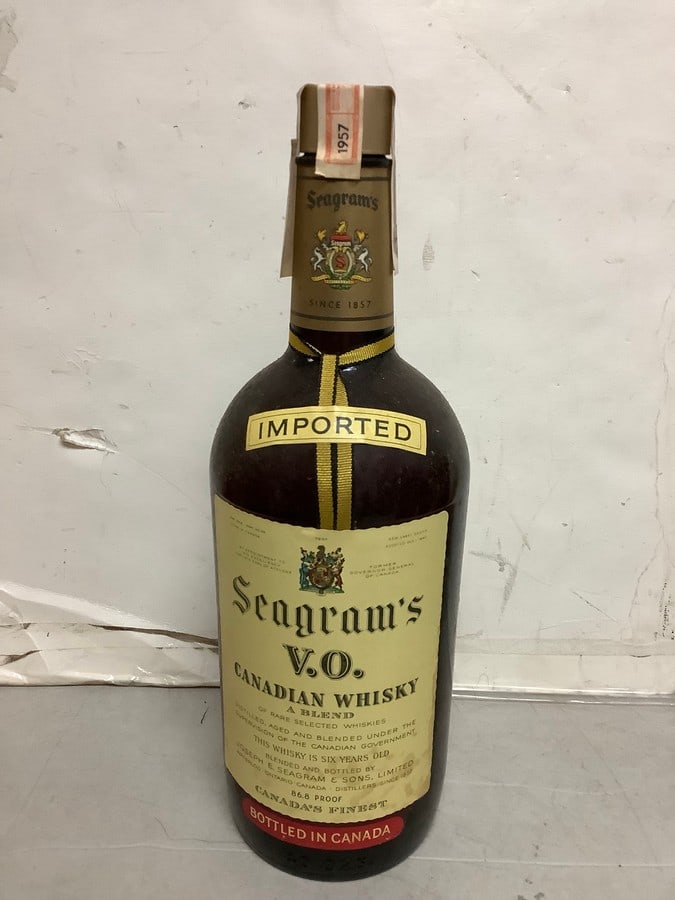 1957 Imported Seagram's V.O. canadian whisky 86.8 proof 40ozs.(sealed): Any contents in bottle is Free; You are bidding on the bottle & unbroken tax stamp