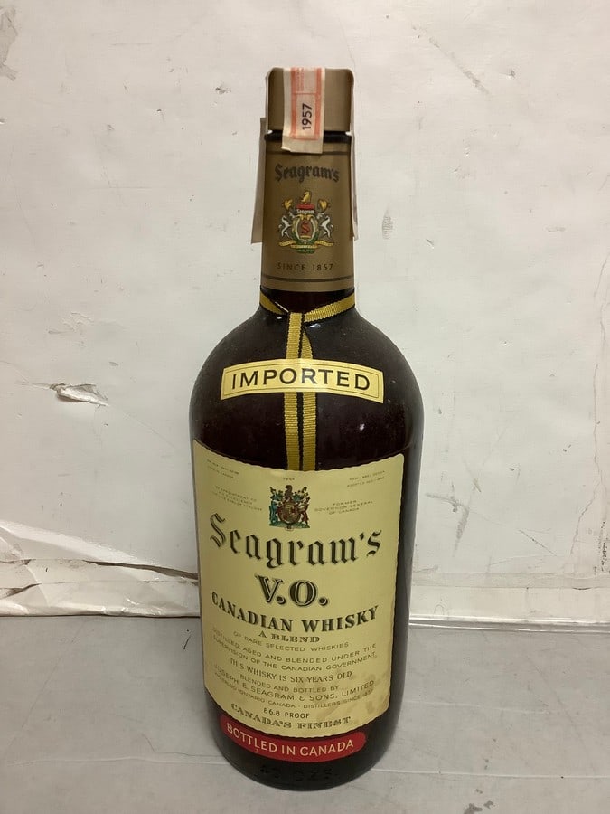 1957 Imported Seagram's V.O. canadian whisky 86.8 proof 40ozs.(sealed): Any contents in bottle is Free; You are bidding on the bottle & unbroken tax stamp