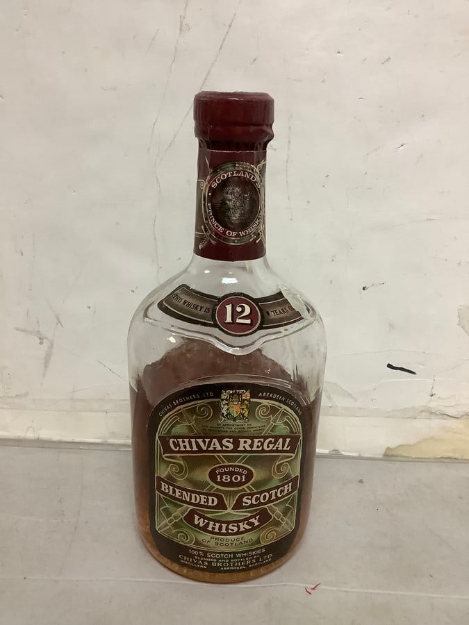 1950's/1960's Chivas Regal blended scotch whisky(half full): Any contents in bottle is Free; You are bidding on the bottle & unbroken tax stamp