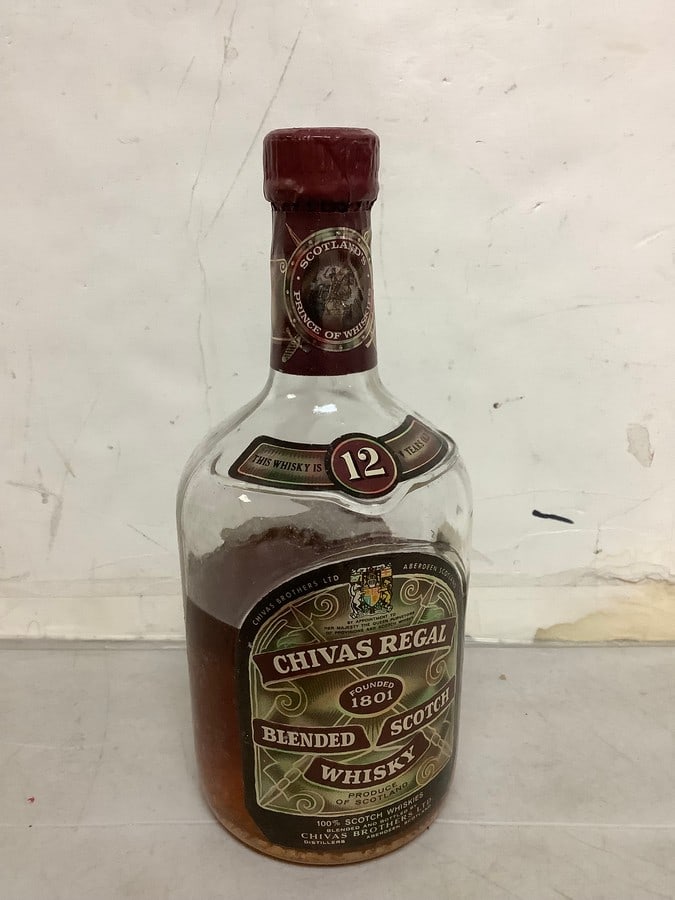 1950's/1960's Chivas Regal blended scotch whisky(half full): Any contents in bottle is Free; You are bidding on the bottle & unbroken tax stamp