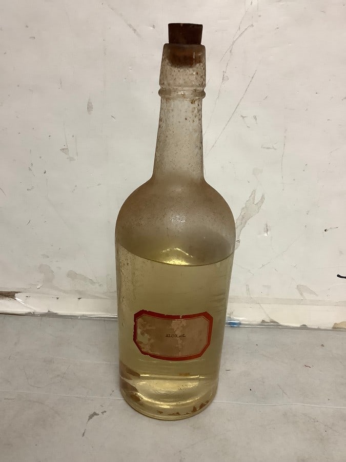Vintage alcohol bottle: Any contents in bottle is Free; You are bidding on the bottle & unbroken tax stamp