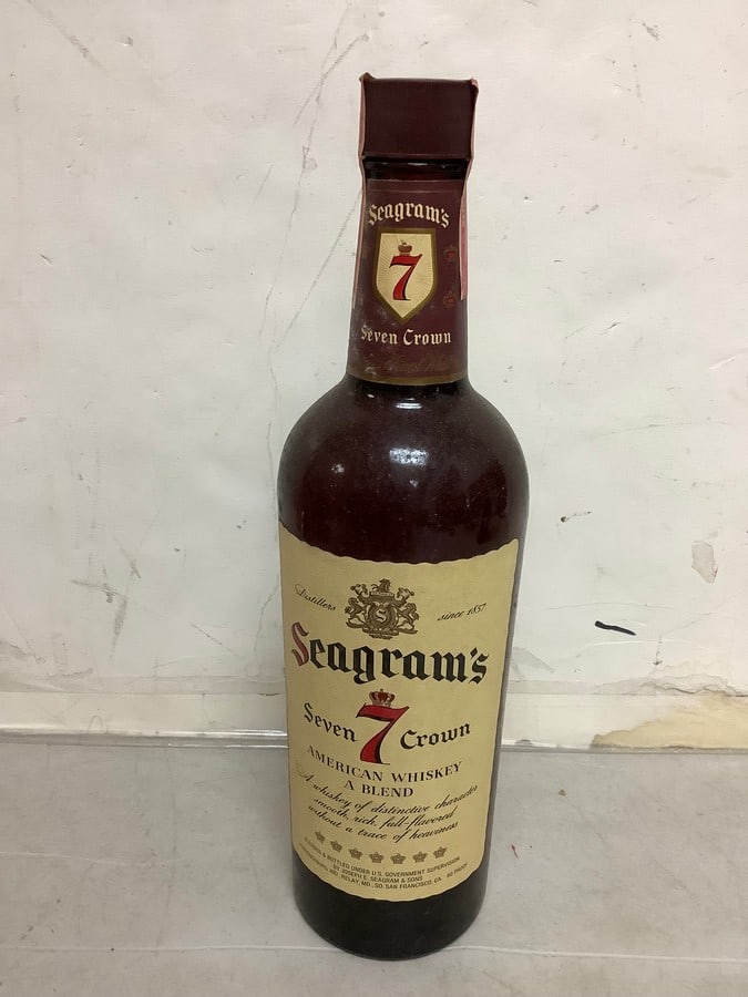 1950's/1960's Seagram's Seven Crown American Whiskey 80 proof(sealed): Any contents in bottle is Free; You are bidding on the bottle & unbroken tax stamp