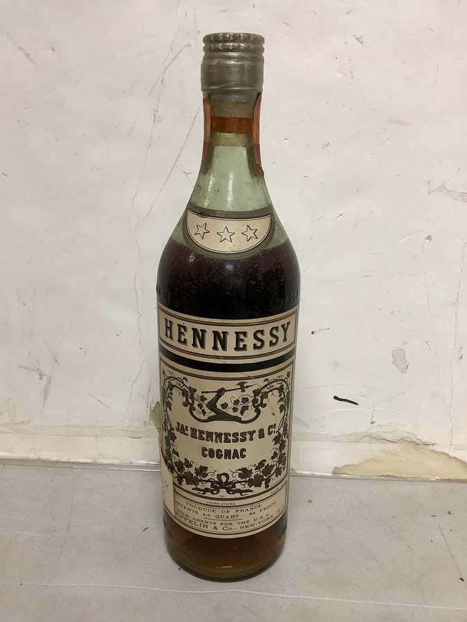 1950's/1960's Hennesy 84 proof 4/5 quart(mostly full): Any contents in bottle is Free; You are bidding on the bottle & unbroken tax stamp