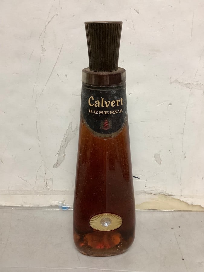 1950's/1960's Calvert reserve 86.8 proof 4/5 quart(seal torn): Any contents in bottle is Free; You are bidding on the bottle & unbroken tax stamp