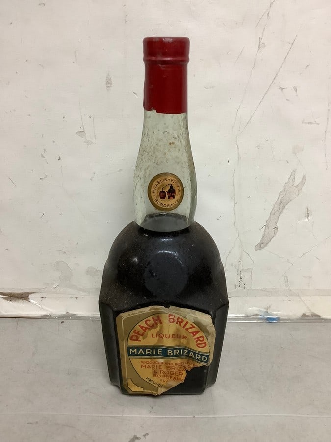 1950's/1960's Marie Brizard Peach Brizard liqueur(mostly full): Any contents in bottle is Free; You are bidding on the bottle & unbroken tax stamp