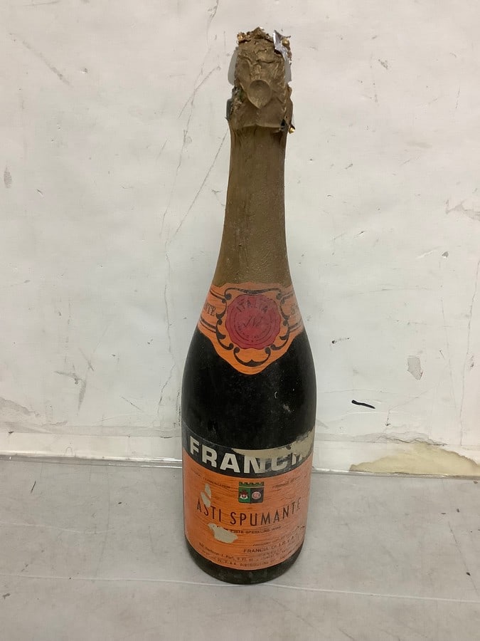 1950's/1960's Franch Asti Spumante white sparkling wine( 1 pint 9 fl.oz., 10%, sealed): Any contents in bottle is Free; You are bidding on the bottle & unbroken tax stamp