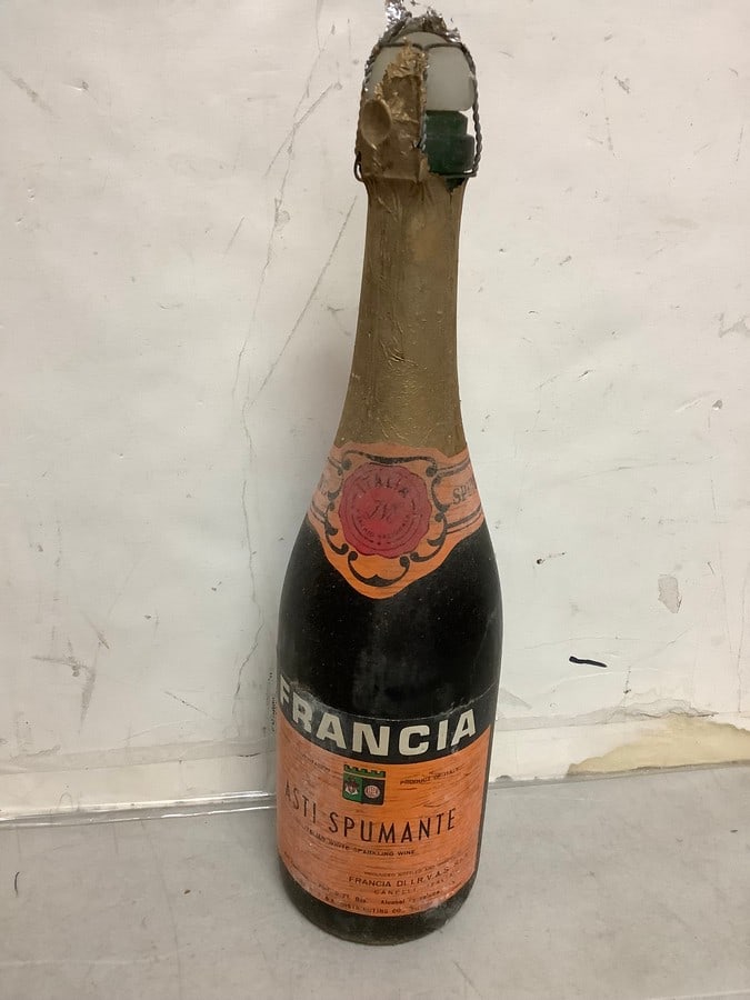1950's/1960's Franch Asti Spumante white sparkling wine( 1 pint 9 fl.oz., 10%, sealed): Any contents in bottle is Free; You are bidding on the bottle & unbroken tax stamp