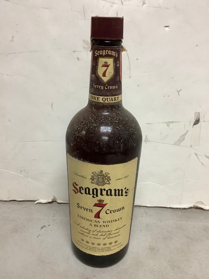 Seagram's Seven Crown American Whiskey blend 86 proof one quart(mostly full): Any contents in bottle is Free; You are bidding on the bottle & unbroken tax stamp