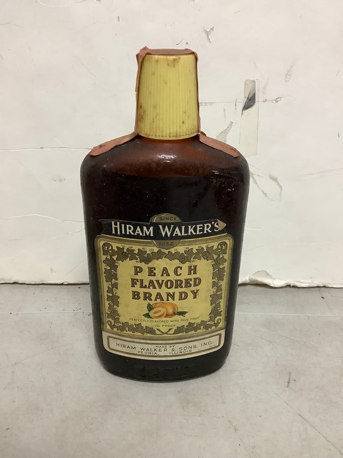 Hiram Walker's Peach flavored Brandy 70 proof 4/5 pint(sealed): Any contents in bottle is Free; You are bidding on the bottle & unbroken tax stamp
