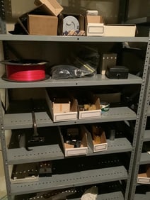Contents of metal shelving unit(air filter, Nebo lantern, and more)