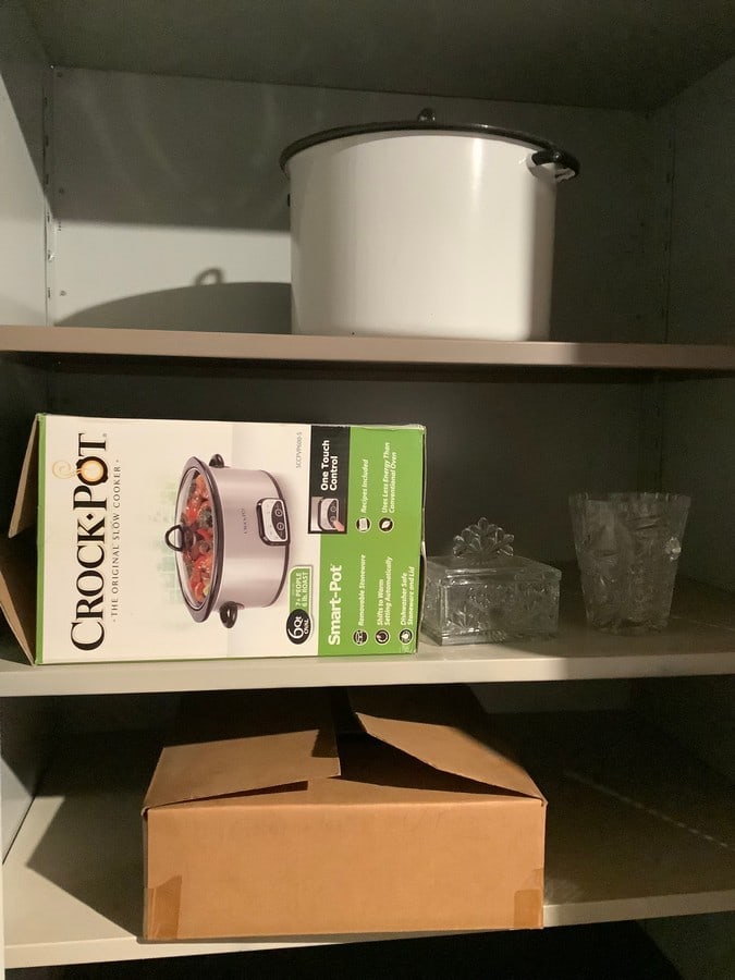 Contents on shelves(Crock pot, glass ice bucket, glass container with lid, and more) (1 of 1)