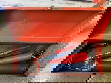 Metal toolbox with grease gun