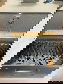 Brumberger metal case((10in.x5.5in.x6in.) with film reels