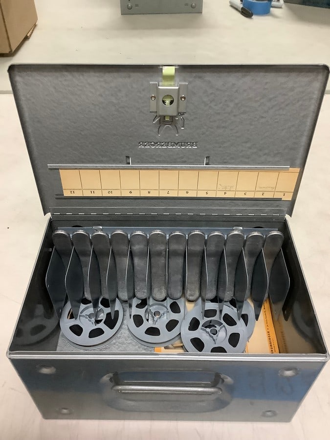 Brumberger metal case((10in.x5.5in.x6in.) with film reels: Brumberger metal case((10in.x5.5in.x6in.) with film reels