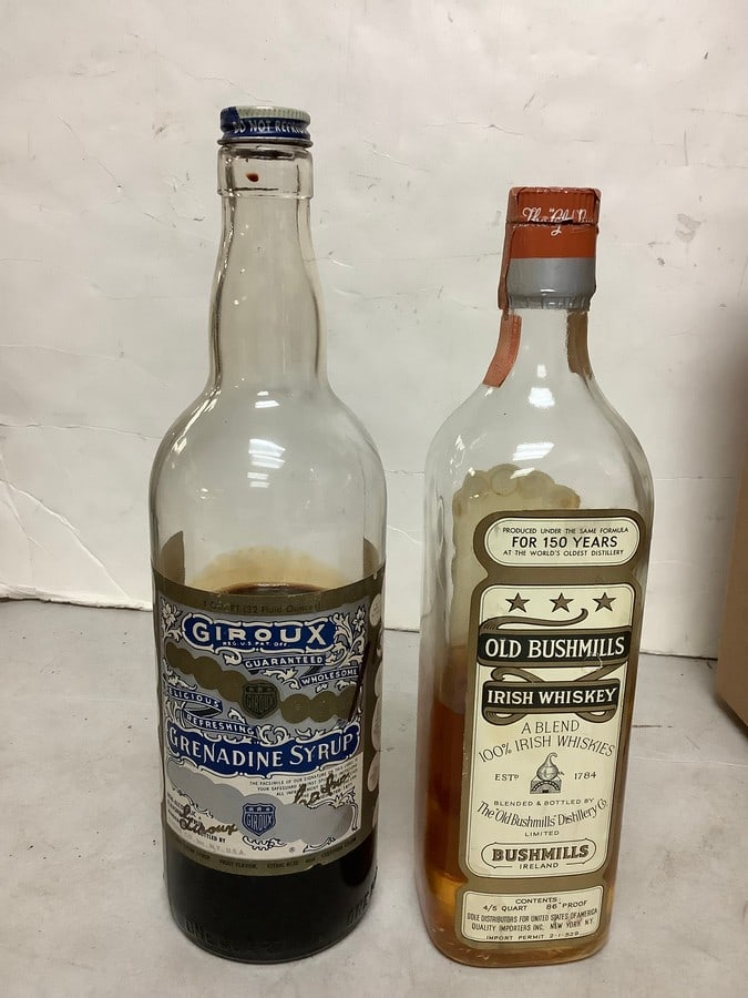 Old Bushmills Irish Whiskey 86 proof one quart(about 1/2 full) and Giroux grenadine syrup(1/2 full) (1 of 1)