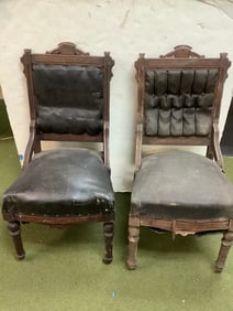 Set of 2 antique chairs with wheels on front end(1 wheel missing from one chair)