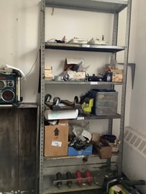 Metal shelving unit and contents on shelf